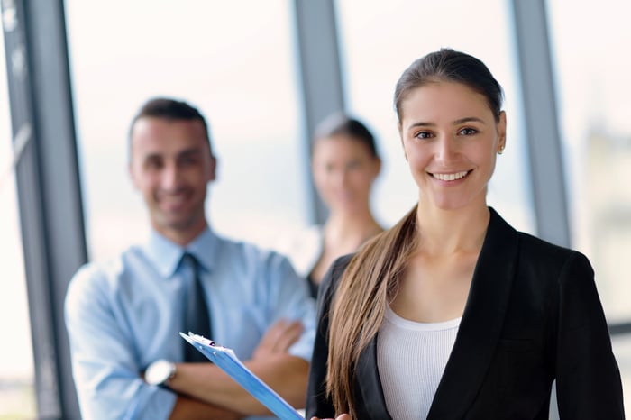 Group of happy young  business people in a meeting at office-1